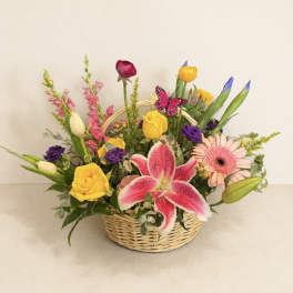 Mixed flower basket with pink lily, yellow roses, and gerbera daisies