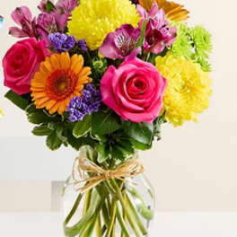 Colorful mixed bouquet in a clear glass vase