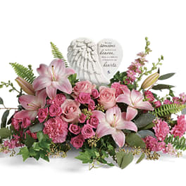 Pink lilies and roses arranged with a memorial angel heart plaque