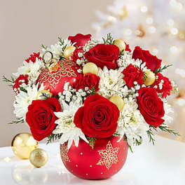 Red roses and white daisies in a red ornament vase