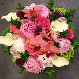 Pink bouquet with orchids, roses, peonies, and white calla lilies