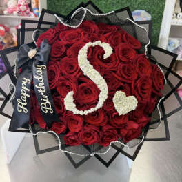 Red rose bouquet with a white floral number 3 and heart accent