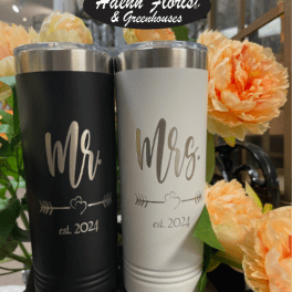 Two engraved tumblers with Mr. and Mrs. text beside peach flowers