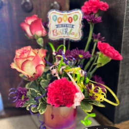 Birthday bouquet with pink roses and carnations in a vase