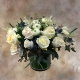 White rose bouquet in a dark green vase