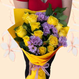 Bouquet of yellow roses and purple daisies wrapped in yellow paper