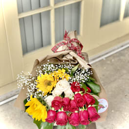 Bouquet of red, white, and yellow roses with sunflowers