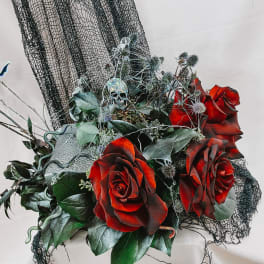Dark red roses with black mesh and a small skull decoration