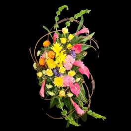 Tall mixed bouquet with pink, yellow, and orange flowers