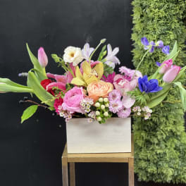 Colorful mixed bouquet in a white rectangular box