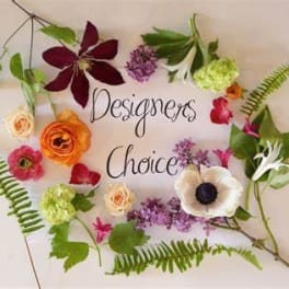 Assorted flowers arranged around the words "Designers Choice"