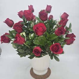 Bouquet of red roses in a white vase