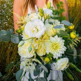 White and pale yellow bridal bouquet with eucalyptus and mixed greenery