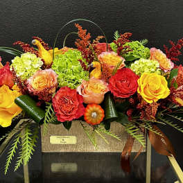 Bright mixed bouquet of roses and hydrangeas in a rectangular box