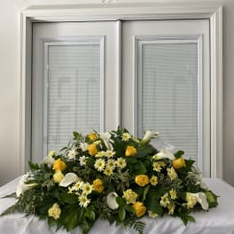 Large white and yellow floral spray with calla lilies and roses