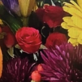 Colorful bouquet with lilies, roses, and purple mums