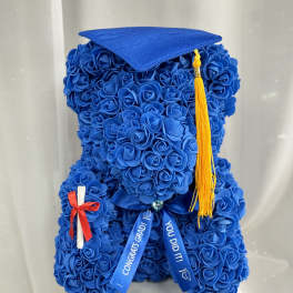 Blue rose-covered graduation teddy bear with cap and tassel