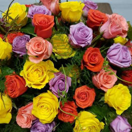 Bouquet of multicolored roses with green filler