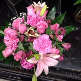 Pink bouquet with roses, lilies, and carnations