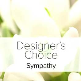 White flowers behind a label reading Designer's Choice Sympathy