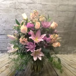 Pink and peach mixed bouquet with lilies and chrysanthemums in a vase