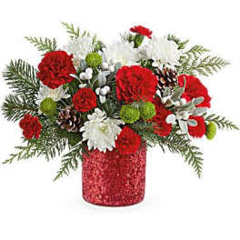 Red and white floral arrangement in a glittery red vase