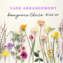 Assorted flowers arranged around a vase arrangement sign