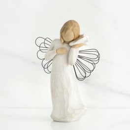 Small angel figurine in a white dress with wire wings