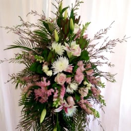 Tall floral standing spray with pink and white blooms