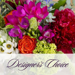 Mixed bouquet with bright purple, red, orange, and white flowers