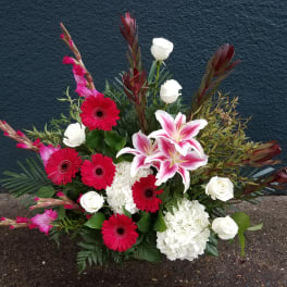 Mixed bouquet with pink lilies, red gerberas, and white roses