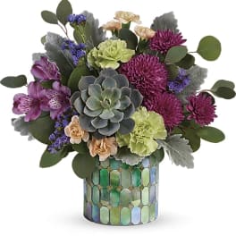 Mixed bouquet with a succulent in a mosaic glass vase