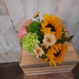 Bouquet with sunflowers, pink roses, and pale daisies