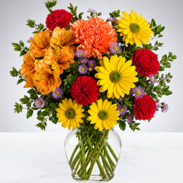 Colorful mixed bouquet in a clear glass vase