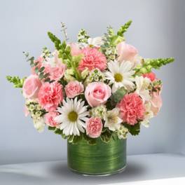 Pink and white mixed bouquet in a green cylindrical vase