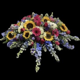 Large mixed flower spray with sunflowers, pink gerberas, and roses