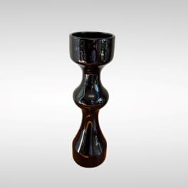 Black glossy decorative candle holder on a white background