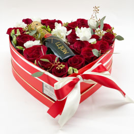 Heart-shaped box of red and white roses with a mini Moet bottle