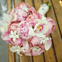 Pink and white bridal bouquet with roses and orchids