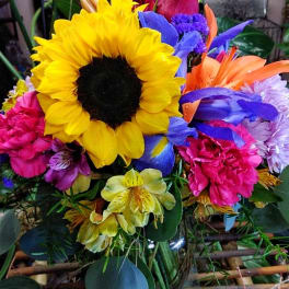 Bright mixed bouquet with a large sunflower and colorful blooms