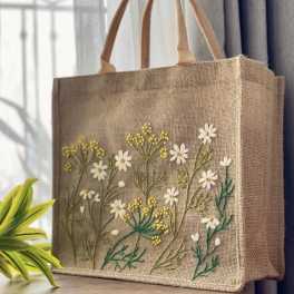 Burlap tote bag with embroidered white and yellow flowers