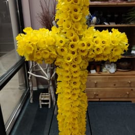 Large yellow floral cross made of daffodils