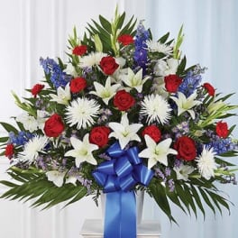 Large bouquet of red roses and white lilies with blue ribbon