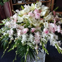 Large white and pale pink floral spray with lilies and roses