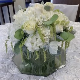 White floral bouquet in a mirrored hexagonal vase