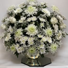 White chrysanthemum and rose arrangement in a silver vase