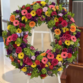 Large colorful floral wreath on a standing easel