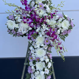 Cross-shaped floral spray with white and lavender blooms and purple orchids