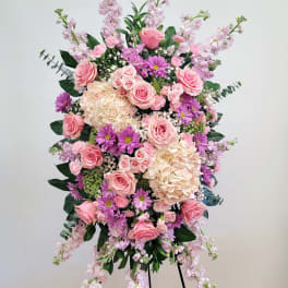Tall pink and lavender floral spray on a stand