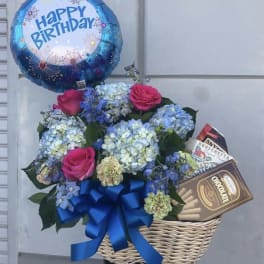 Birthday balloon with a flower basket and chocolates